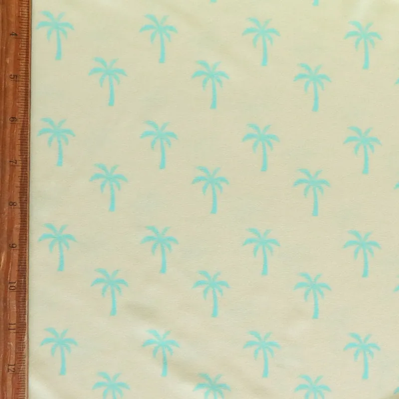 Bright Blue Palms on Light Yellow Poly Spandex Swimsuit Fabric